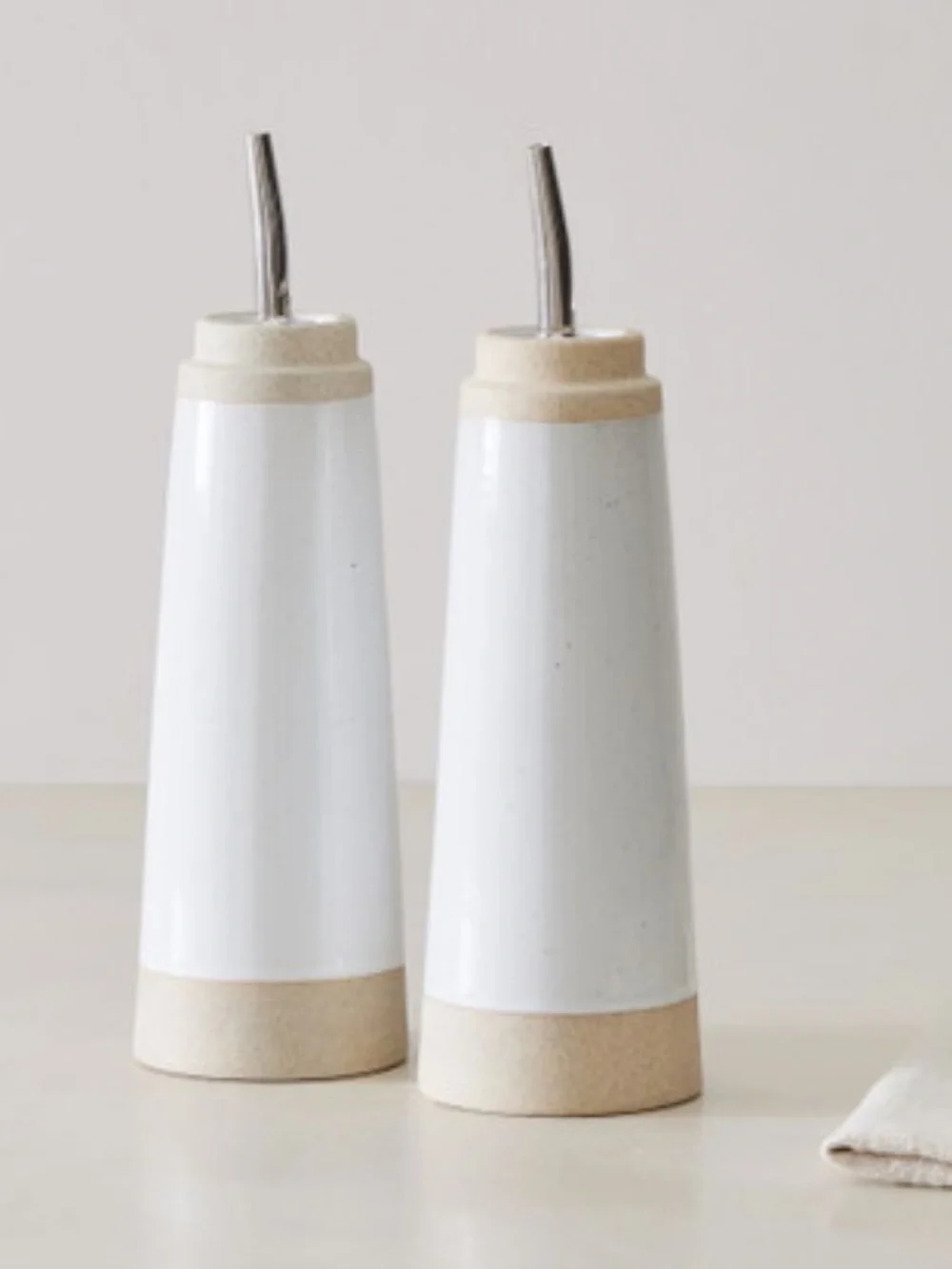 West Elm Ceramic Oil & Vinegar Pourers in White and Tan